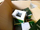a box full of books and a watch in it
