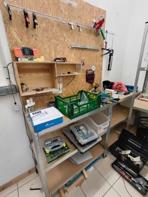 a workbench with tools on it in a room