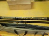 two fishing rods that are sitting on a table