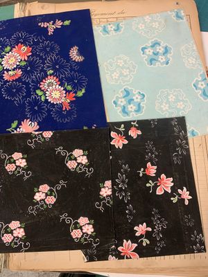 several pieces of fabric are laid out on a table with scissors