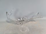 clear glass bowl with a flower design on top of a table