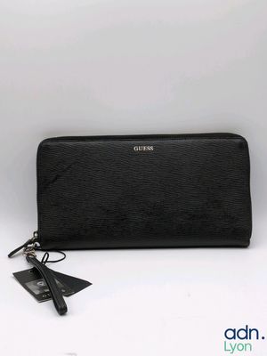a black long wallet with a tag on the side of it