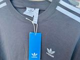 a close up of a shirt hanging on a rack in a store