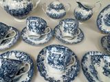 many blue and white china dishes and cups and saucers