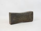 a close up of a wooden block on a white surface