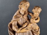 an image of a statue of a woman holding a child
