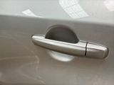 a silver door handle on a silver car