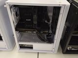 two computer cases sitting on a table in a room