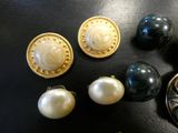 a lot of different types of jewelry on the table