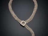 un collier en argent et diamants, signé Cartier