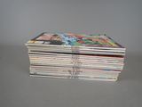 a stack of comics sitting on top of each other on a table