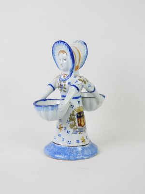 figurine of a woman holding a basket of flowers
