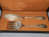 three spoons and a fork in a case
