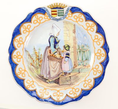a plate with a picture of a woman and a child on it