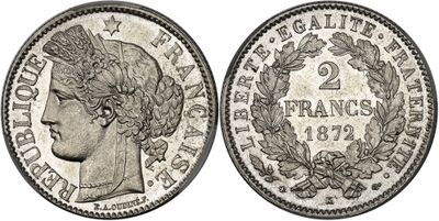 a silver coin with an image of a woman ' s head on it