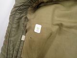 a patch on the back of a jacket that has a sticker on it