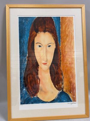 an image of a painting of a woman ' s face in a gold frame