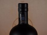 a bottle of wine that is sitting on a table