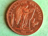 a close up of a penny on a table with a green background