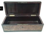 a small wooden box with a metal latch on it