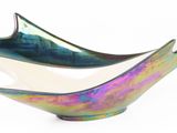 a glass bowl that has a dolphin on it