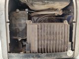 a close up view of a car ' s engine and radiator