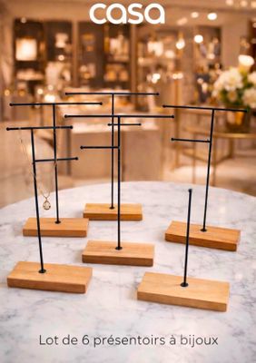 a table with a bunch of wooden stands on top of it