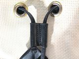 an image of a black and white bag with a bow on it