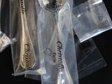a lot of silver spoons and silver spoons in a bag