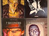four books on a shelf with a man ' s face painted on them