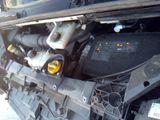 a picture of a car engine with its hood open