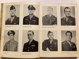 an old book with a bunch of photos of men in military uniforms