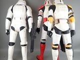 two star wars action figures standing next to each other