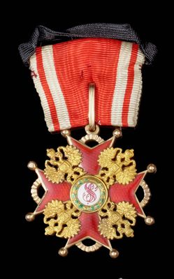 une image représentant une médaille ornée d'une étoile rouge