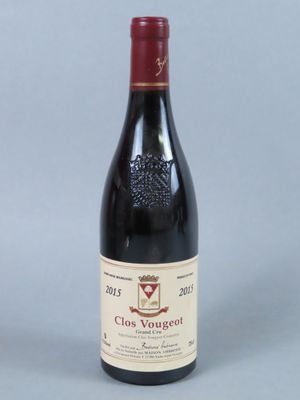a picture of a bottle of red wine on a table