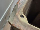 a close up of a piece of wood with a hole in it