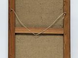 an old wooden frame with a rope hanging from it ' s side