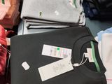 a lot of t - shirts that are on a table