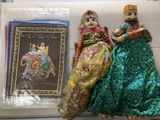 two figurines that are sitting next to each other