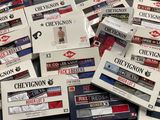 several boxes of chevronn cigarettes are stacked on top of each other