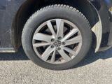 a close up of a car ' s tire on the road