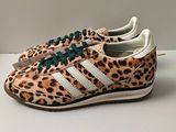 leopard print adidas sneakers with green laces and white soles
