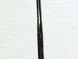a black and white photo of a pair of scissors on a table
