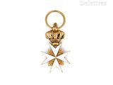 a close up of a gold and white star with a crown on it