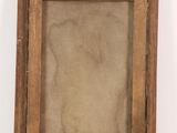 an old wooden picture frame with a white background on a white surface
