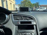 a car dashboard with a cell phone in the center of it