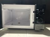 a microwave that is sitting on a counter top