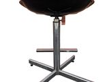 a close up of a black stool on a metal stand