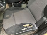 a seat in the back of a car with a pair of pliers on it