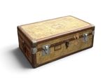 une vieille valise posée par terre